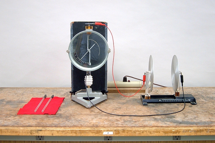 Parallel plates to electroscope