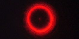 84.12 -- Laser beam diffracted by a ball bearing (Arago’s spot)